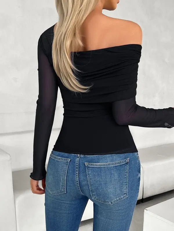 Back view of Asymmetrical one-shoulder blouse styled with jeans in the color black on female model