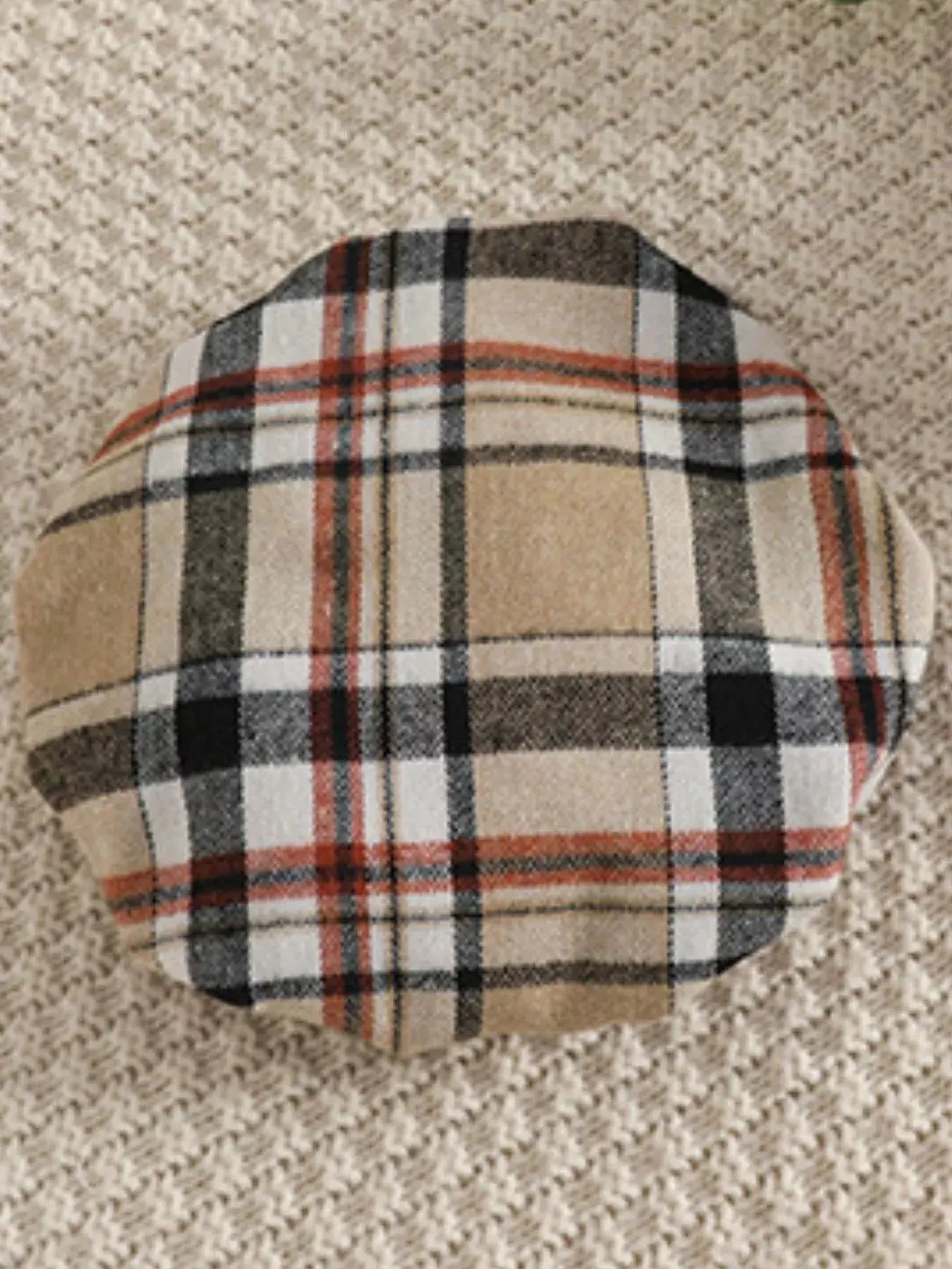 Flat lay of toddler tan beret.