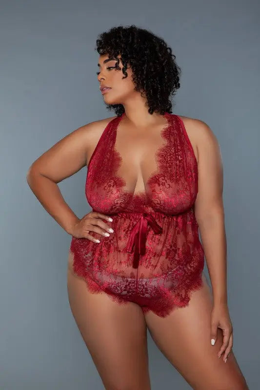 Curvy model wearing rust lace teddy front view