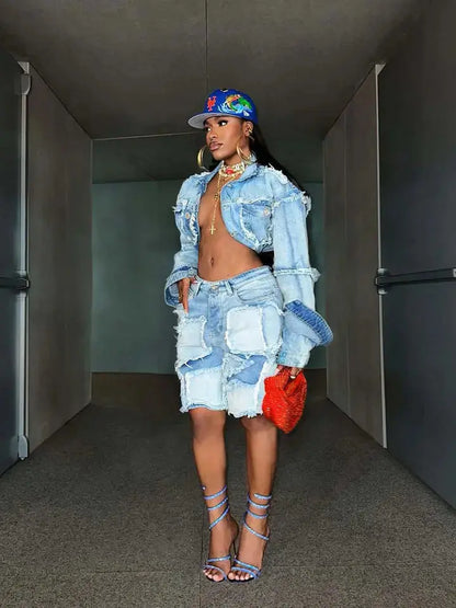 Distressed denim patchwork two-piece set shown in full-body hallway pose.