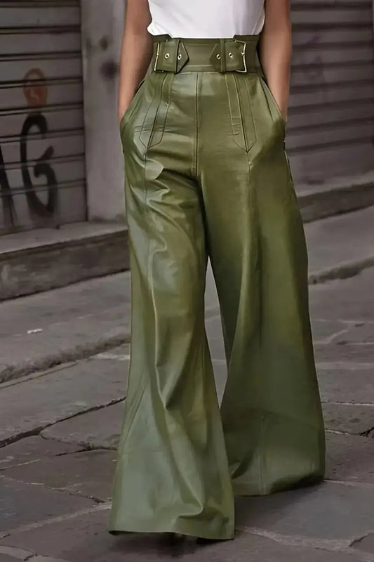 Front view of green faux leather high waist wide leg pants styled with white top.