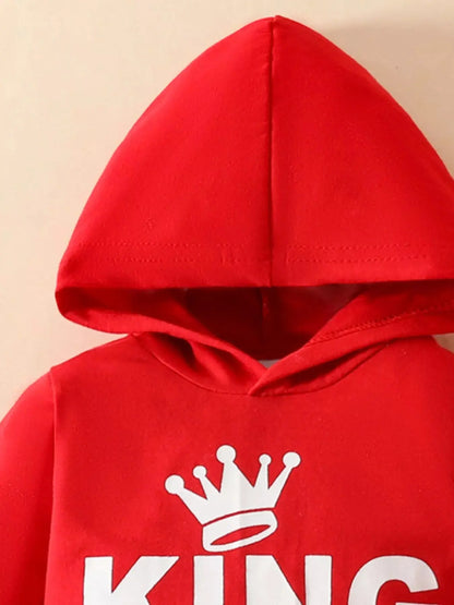 Close-up of KING crown logo on hoodie front.