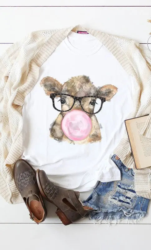 Flat lay of plus size bubble gum cow graphic tee with glasses design.