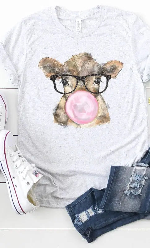 Close-up of quirky cow blowing bubble gum on graphic t-shirt.