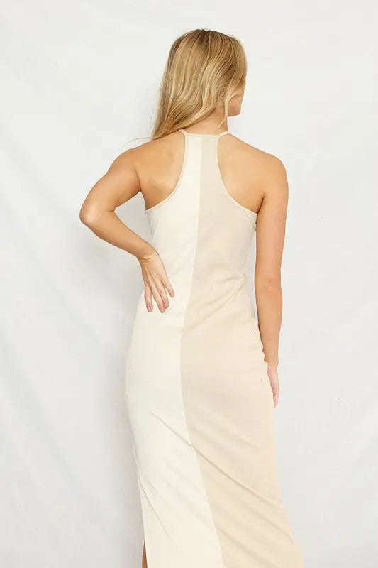 Color block halter dress for women featuring a rib knit fabric, side slit, and modern halter neckline - back view on female model.