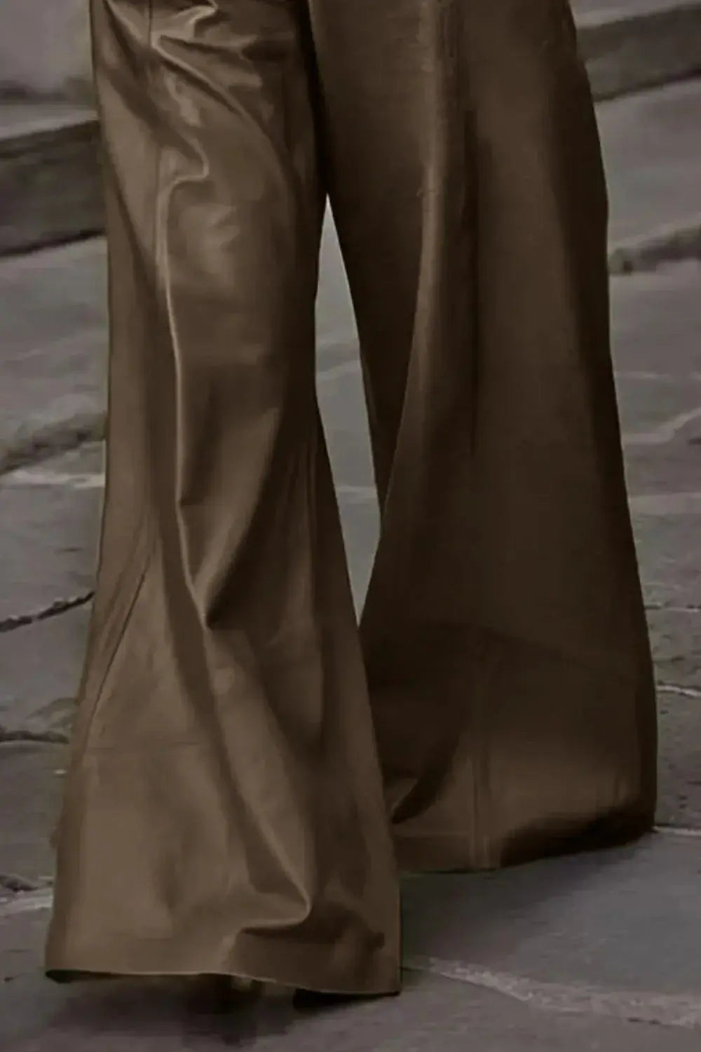 Close-up leg view of brown wide leg pants.