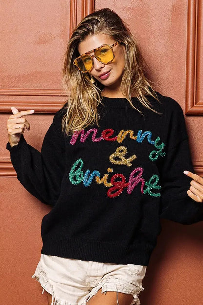 Model in cozy holiday sweater with relaxed fit.