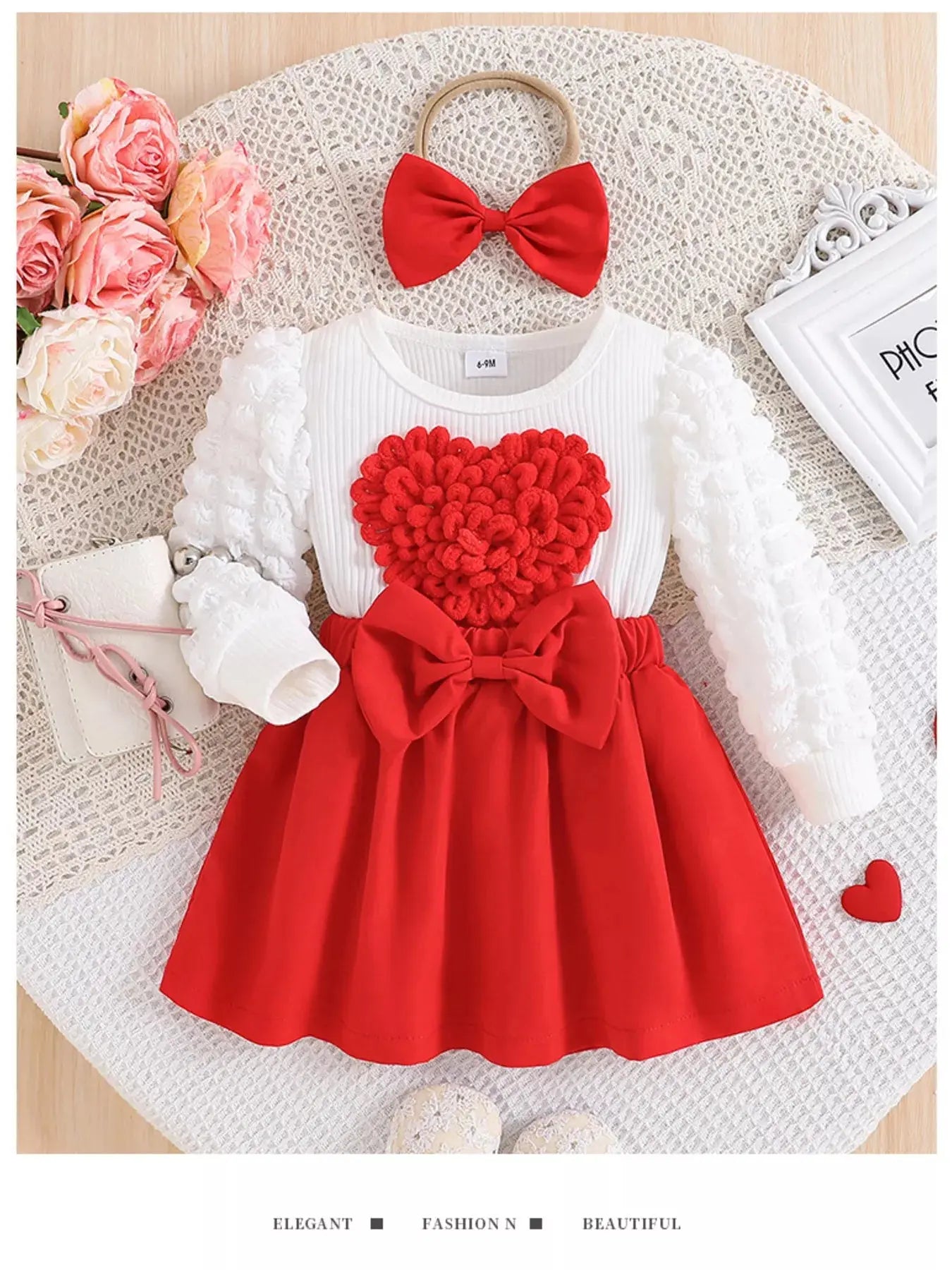 Front view of red heart bow dress set with matching headband.