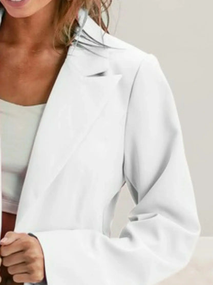 Close up view of BiBi white single breasted peaked lapel blazer styled for Couture Envy