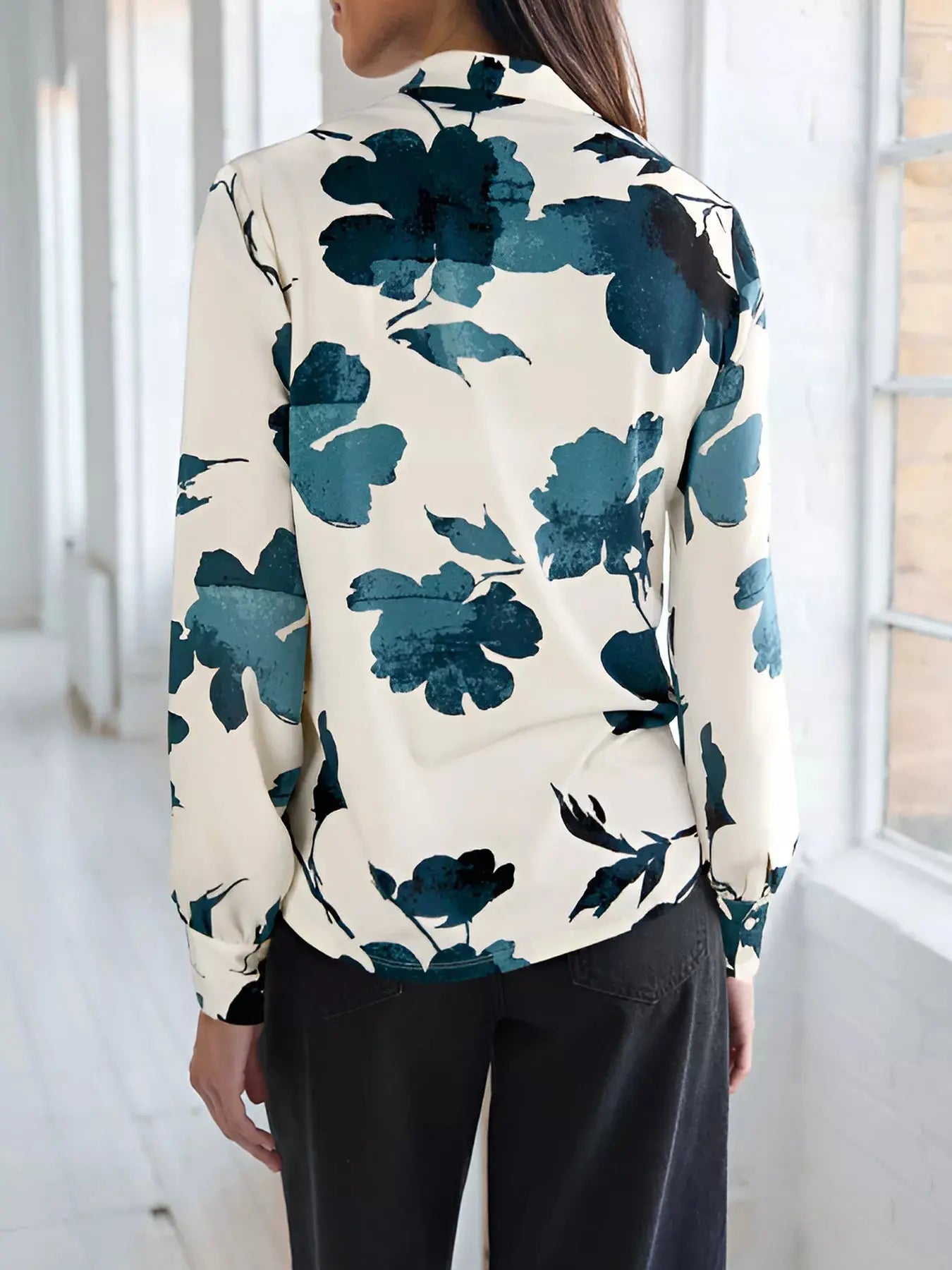 Back view of printed blouse with long sleeves