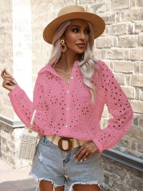 Floral long sleeve eyelet top for women in pink on female model posing.