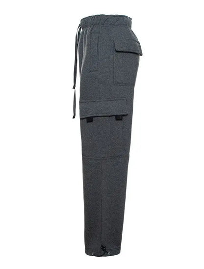 Cargo pocket detail on heavyweight fleece pants - side view in the color charcoal