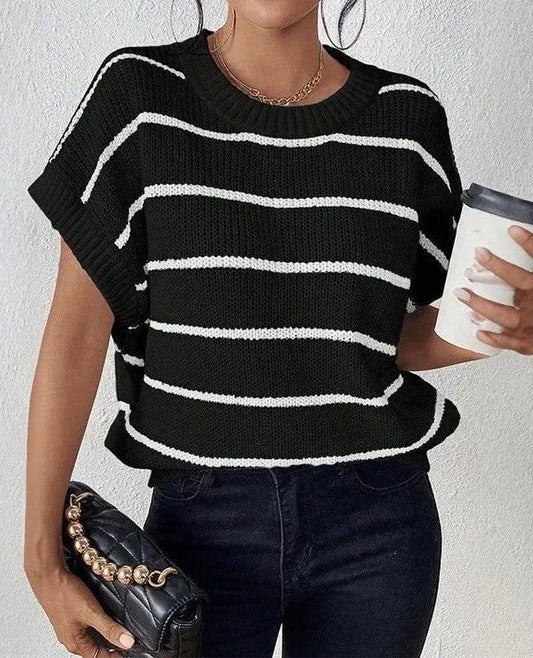 Striped sleeveless sweater for women featuring a lightweight knit design and relaxed fit - black with white stripes on model.