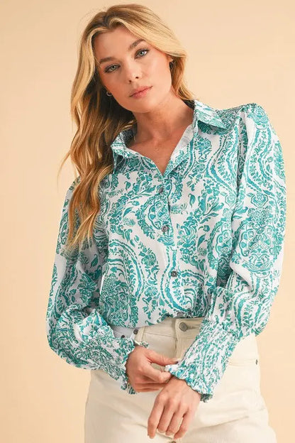 Paisley print smocked cuffs button-down loose women’s blouse on female model posing.