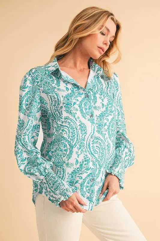 Women’s paisley blouse with smocked sleeve cuffs - slanted view of female model