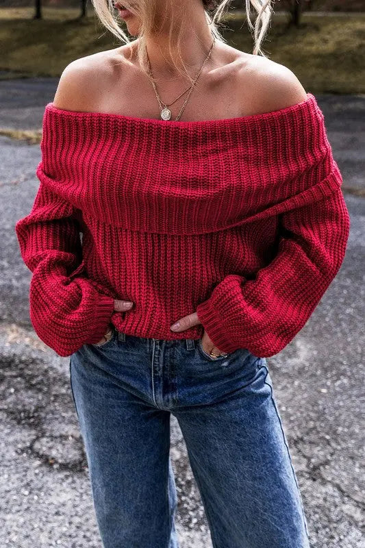 Off shoulder ribbed knit sweater front view in Red on female model posing with hands in pocket