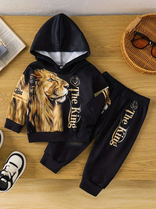 Flat lay of children’s Lion King hoodie and jogger pants set with lion graphic.
