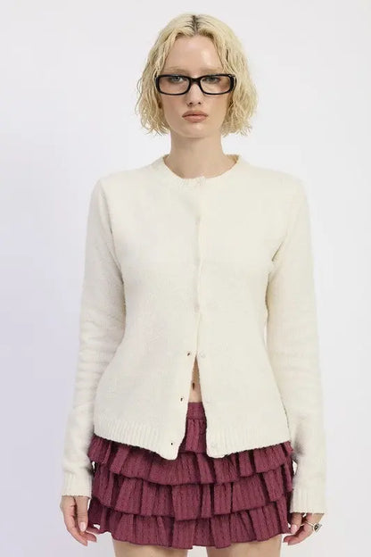 Color option: off white fitted button up cardigan on female model
