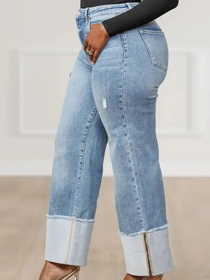 Side view of cuffed hem straight leg jeans showing wide cuff detail