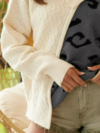 Close-up of cable-knit texture and one-shoulder design - front view