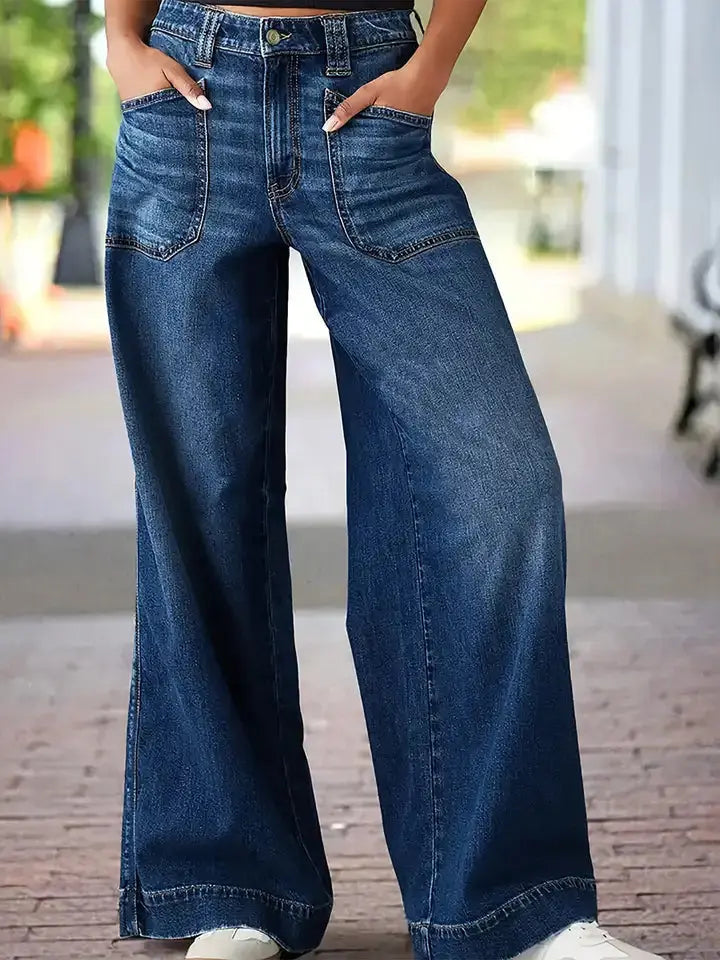 High rise wide leg jeans in deep blue wash displayed front view.