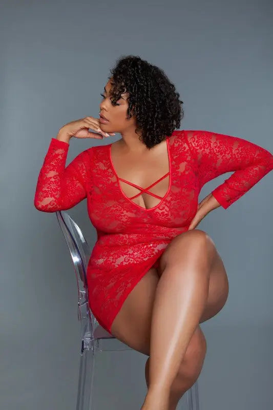 Red lace plus size chemise worn by model in seated pose on chair