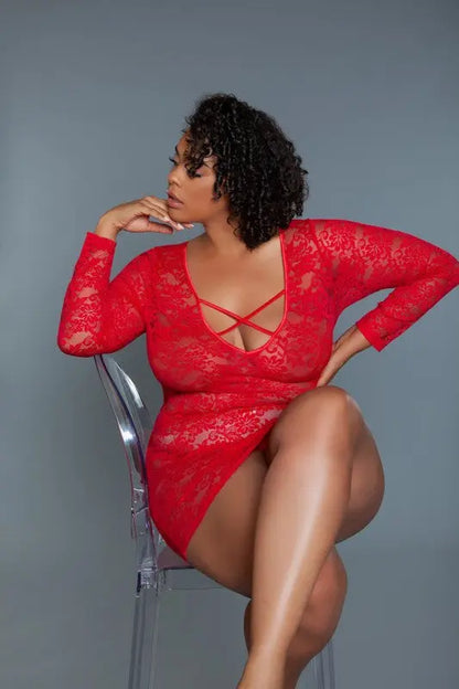Red lace plus size chemise worn by model in seated pose on chair