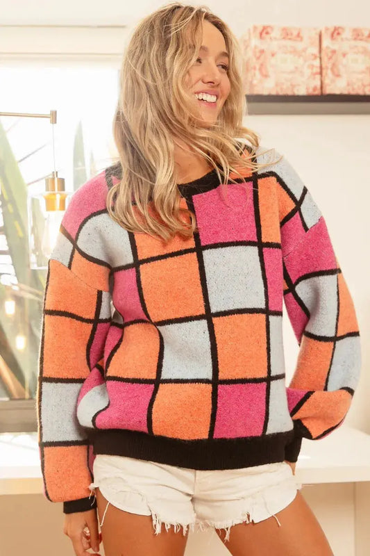 BiBi multicolor sweater posing with hand on hip - female model 