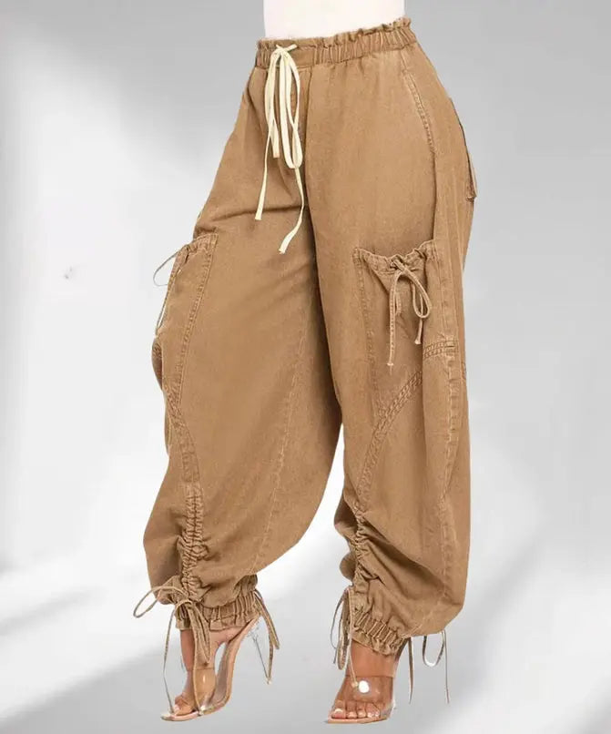 Brown baggy pants with drawstrings on a white background