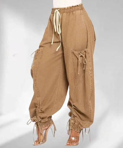 Brown baggy pants with drawstrings on a white background