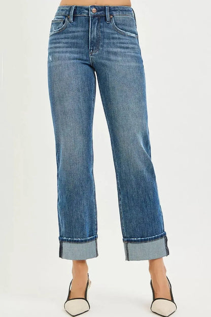 Women’s slouchy straight jeans with cuffed hem on model in heels