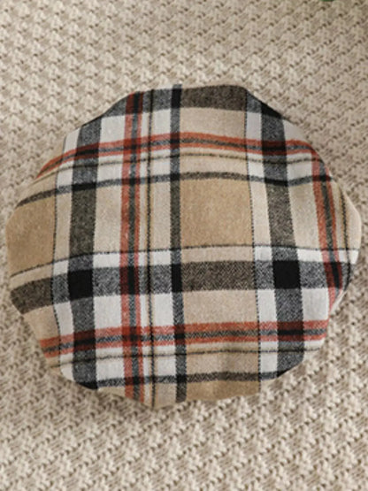 Flat lay of toddler tan beret.