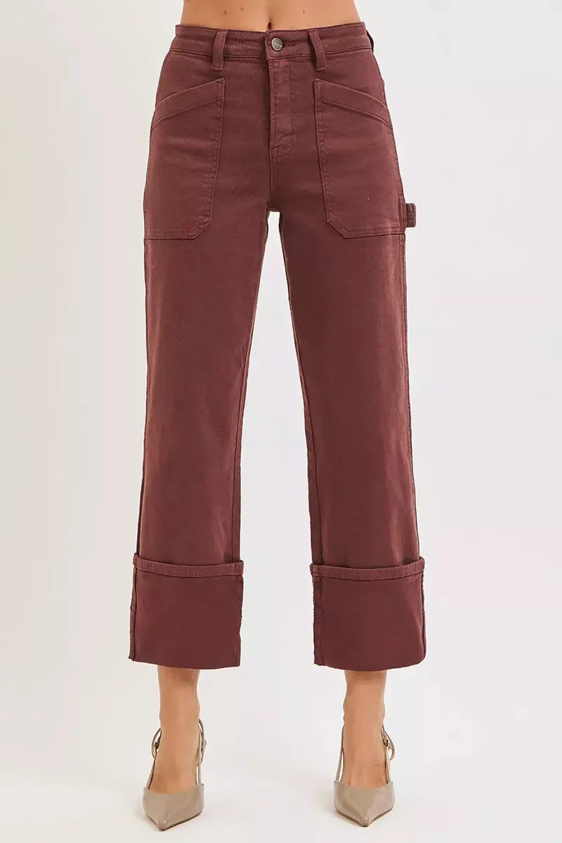 Plus size model wearing burgundy high-rise wide-leg cuffed carpenter jeans, front view