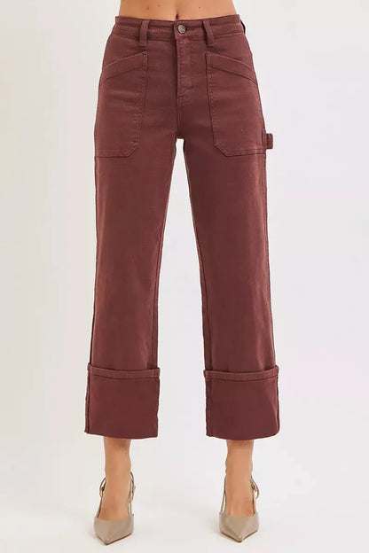 Plus size model wearing burgundy high-rise wide-leg cuffed carpenter jeans, front view