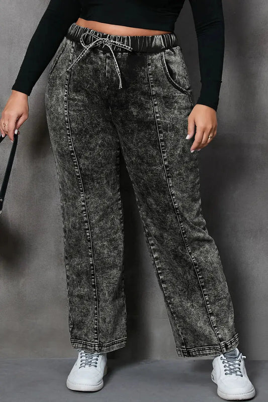 Front view of plus size drawstring pocketed straight jeans in black wash.