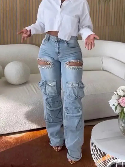 Female model posing with hands out in blue Distressed Wash Cargo Jeans Couture Envy