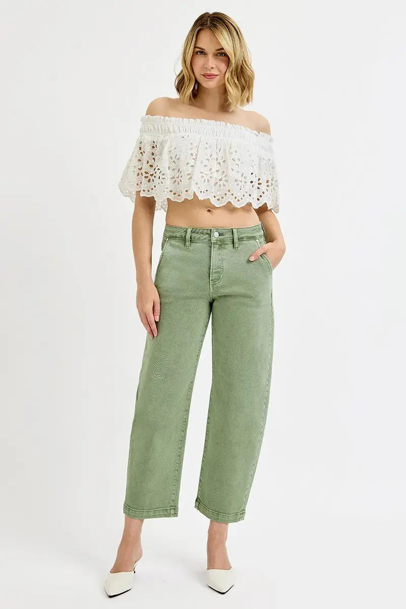 Model wearing olive barrel crop jeans full body front