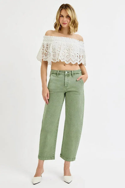 Model wearing olive barrel crop jeans full body front