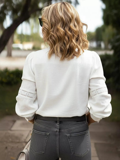Women’s lace trim long sleeve shirt in elegant white - back view.