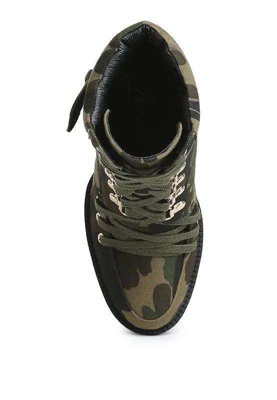Overhead view of combat-style block heel boots in camouflage pattern.