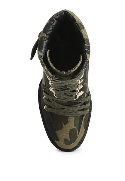 Overhead view of combat-style block heel boots in camouflage pattern.