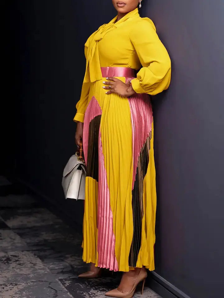 Back view of yellow pleated long-sleeve midi dress