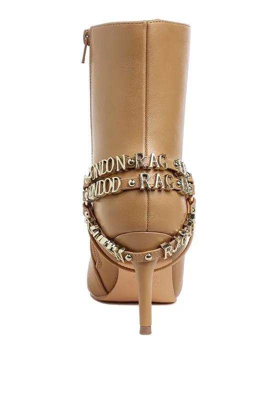 Back view of tall faux leather boots showing zipper closure and slim heel.