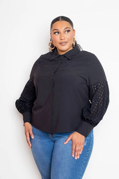 Plus size black blouse with punched sleeves front view on female model posing 