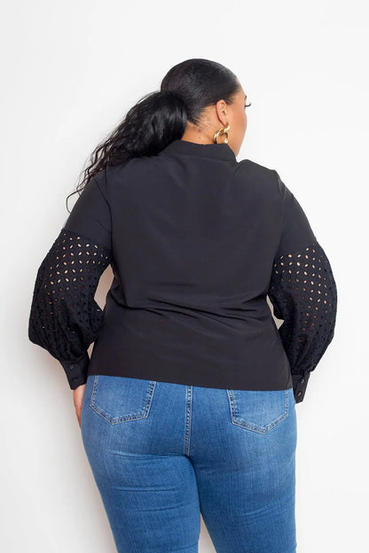 Back view of plus size blouse with punched sleeve detail