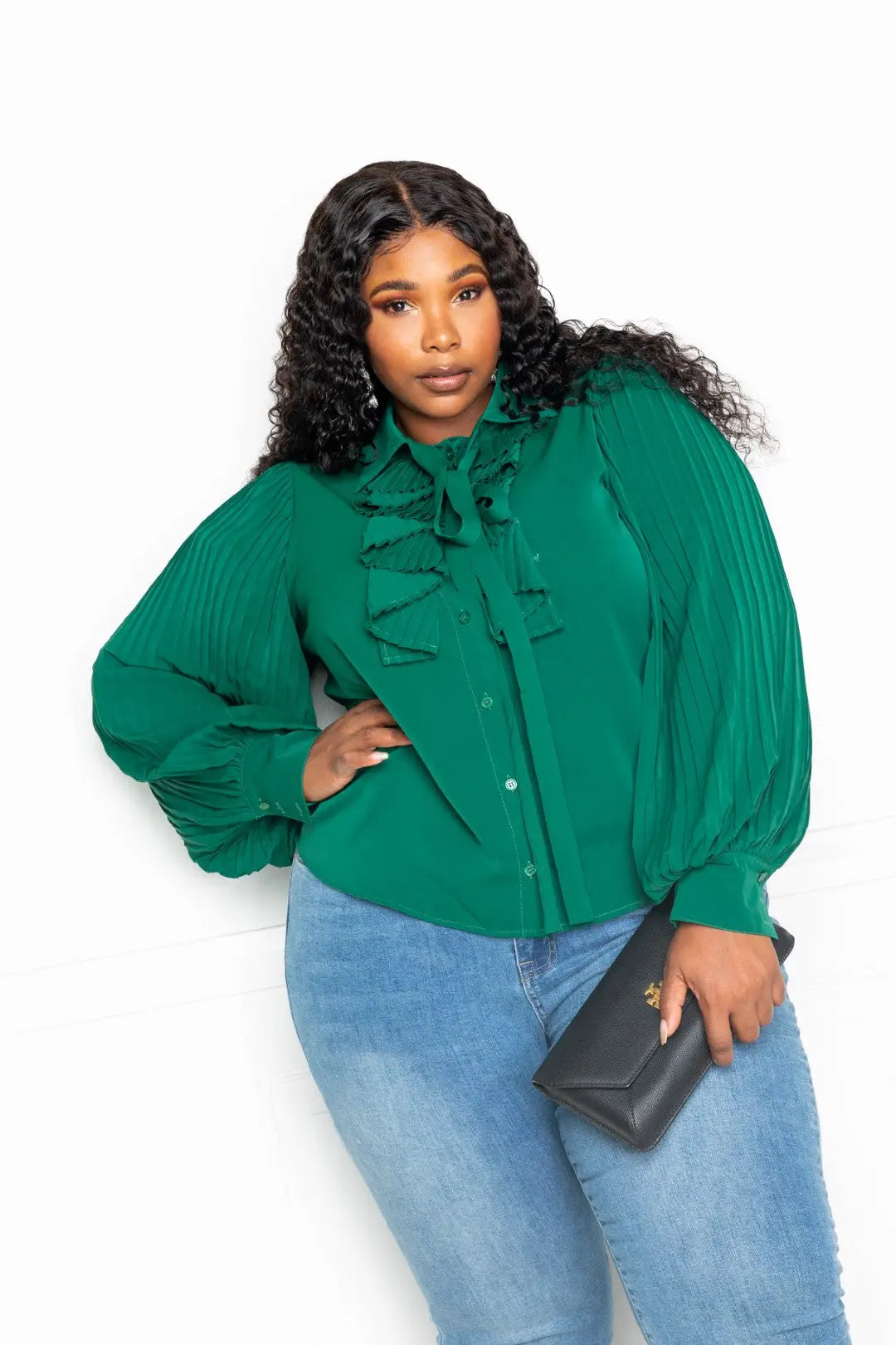 Green waterfall frill blouse styled with jeans – side pose