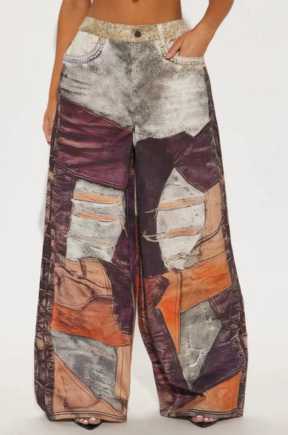 Front view of abstract print wide-leg pants styled with matching crop top.
