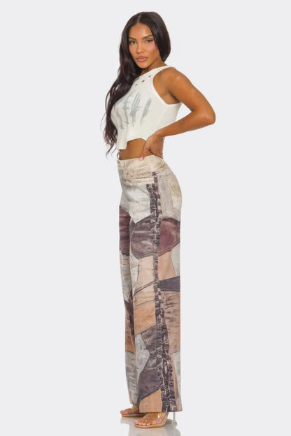Side view of bold fabric printed pants in orange, brown, and cream tones.