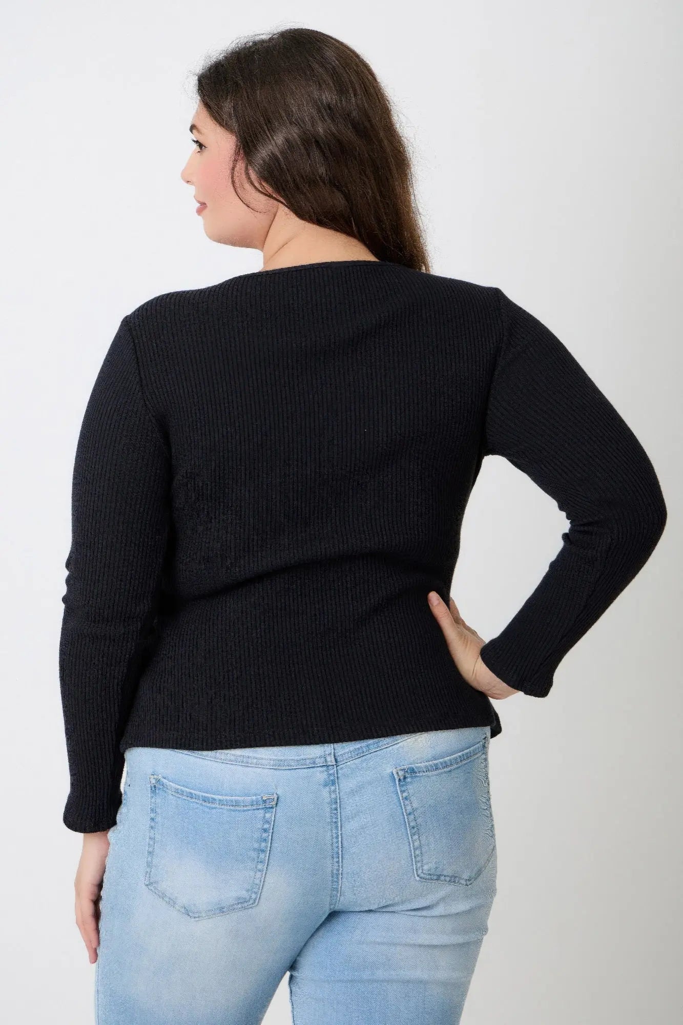 Back view of plus size black ribbed long sleeve top