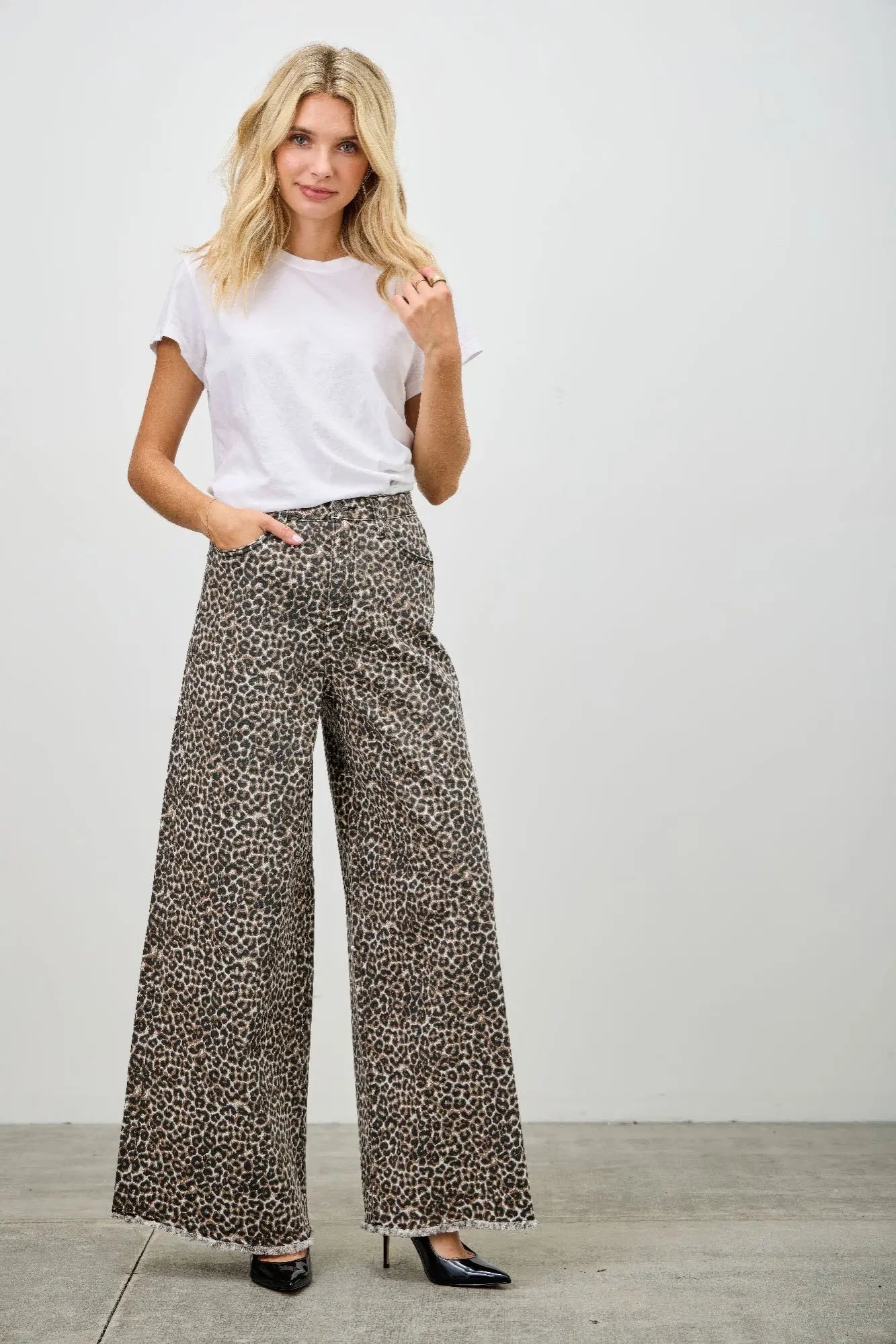 Plus size leopard wide leg jeans full length view on female model posing